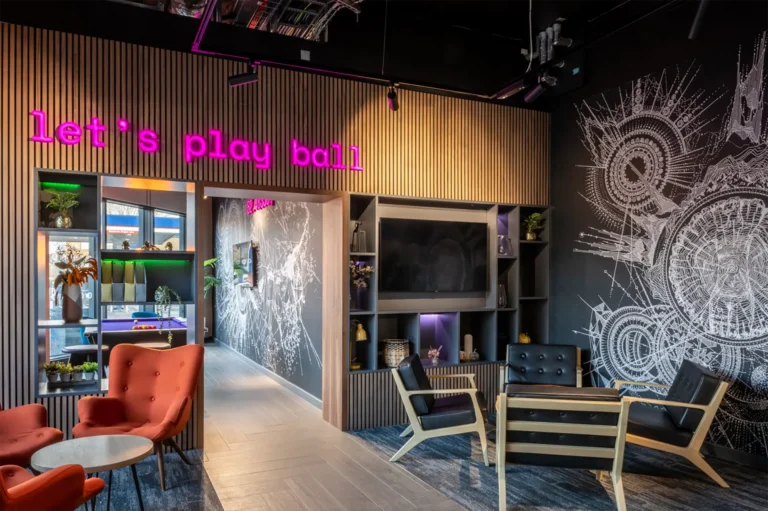 The "Chill" area at Compass. There are comfortable seats in the foreground and a pool table in the background