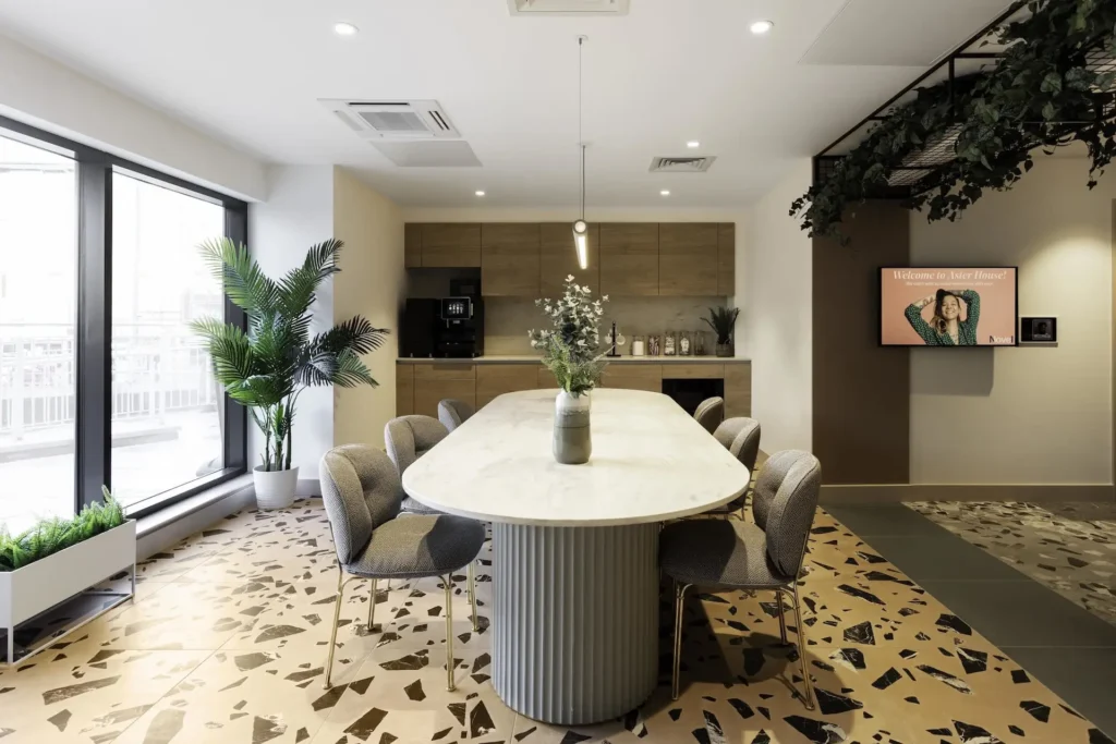 A kitchen, dining area in Aster House. It's very modern.