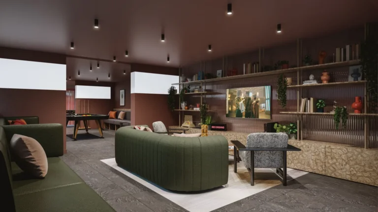 A large lounge with sofas and a wall-mounted TV. To the back of the room is a pool table.